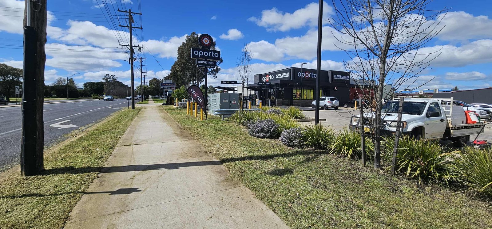 After: Commercial roadside frontage mowing and overgrowth reduction
