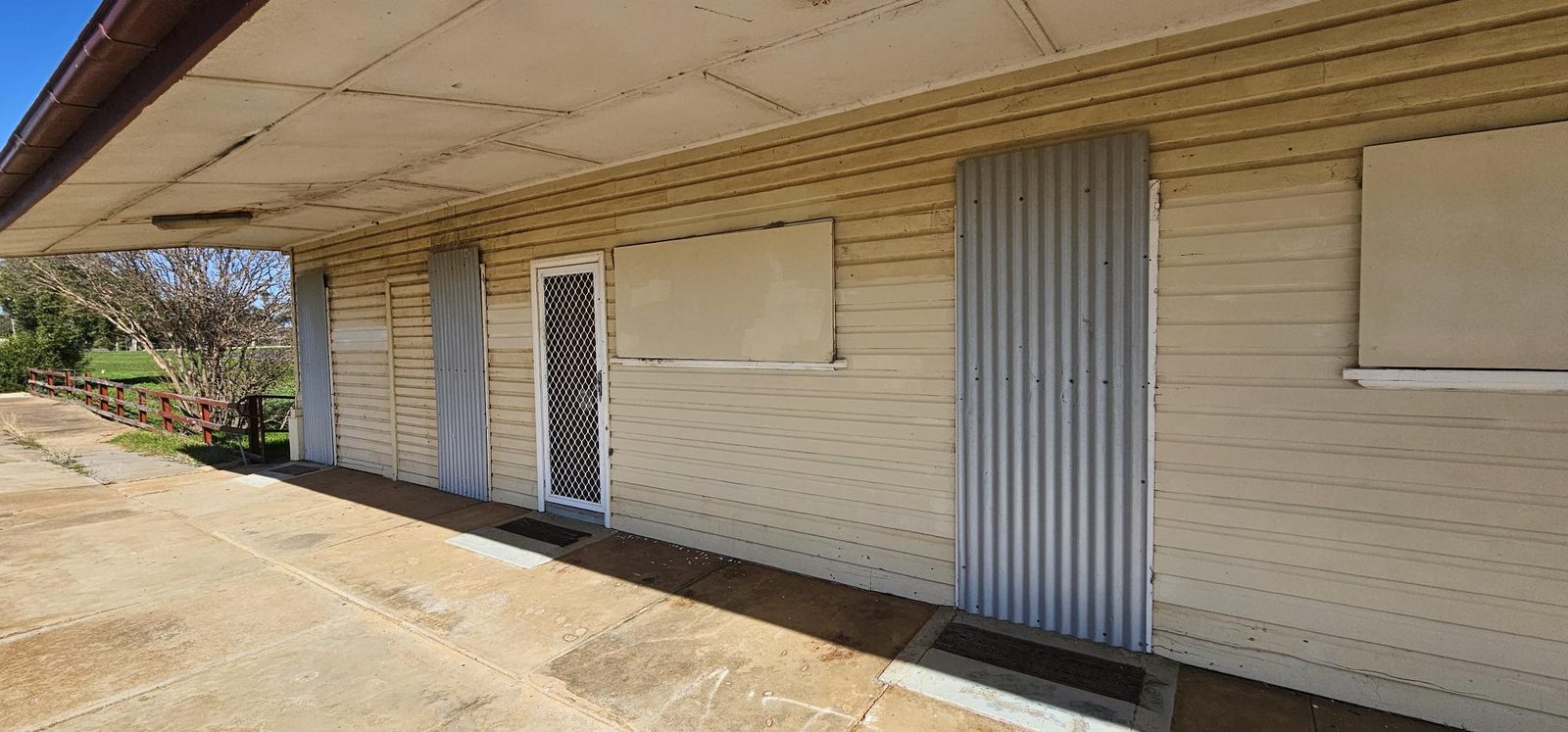 After: Exterior wall before and after graffiti removal and surface coating