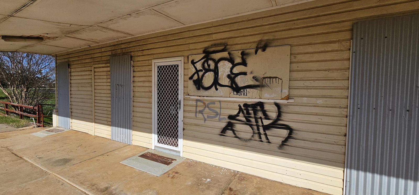 Before: Exterior wall before and after graffiti removal and surface coating